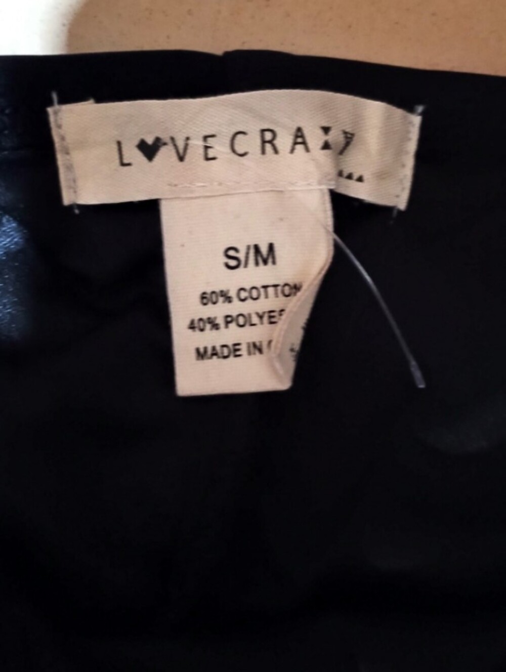 Sculpted Black Ruched Mini Dress with Draped Overlay - Picture 2 of 2
